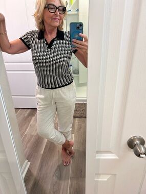 Women’s black and white short sleeve sweater.